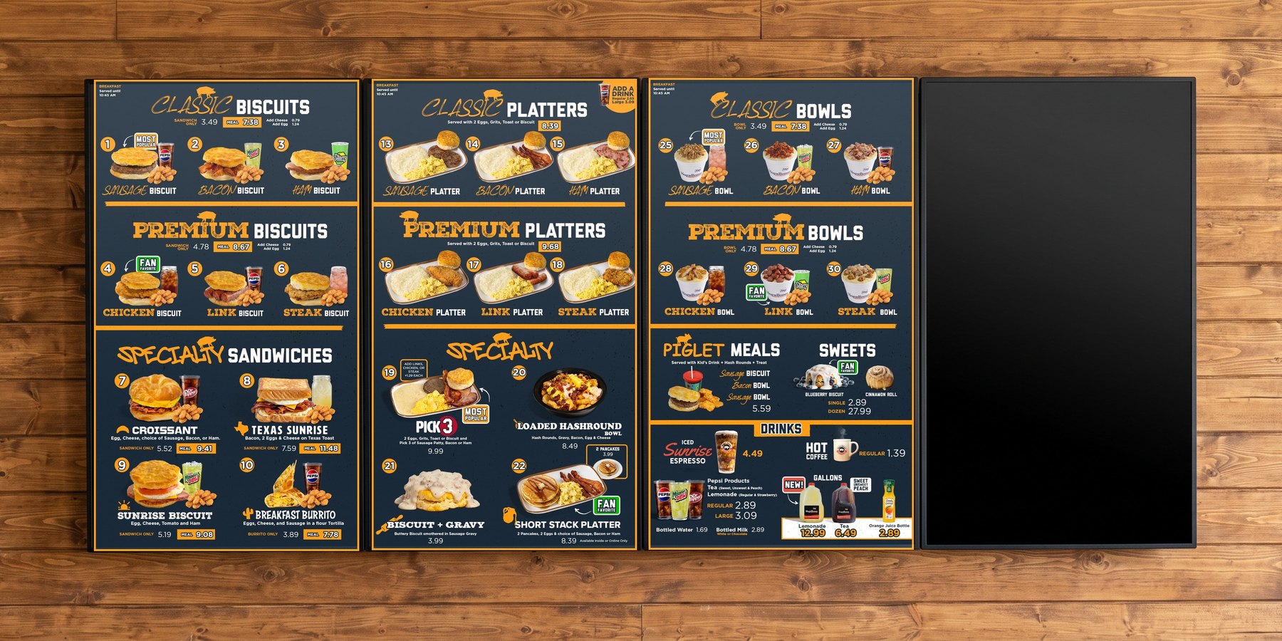 The same four vertical screens on the wood plank wall, switched to the Hog-N-Bones breakfast menu system, with the rotating LTO screen