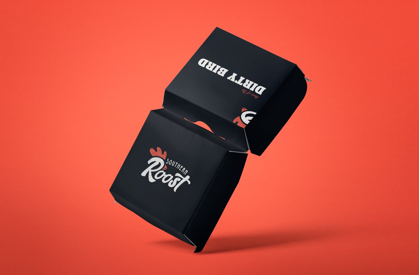 Black Southern Roost sandwich box mockup with the Dirty Bird wordmark, on a red background