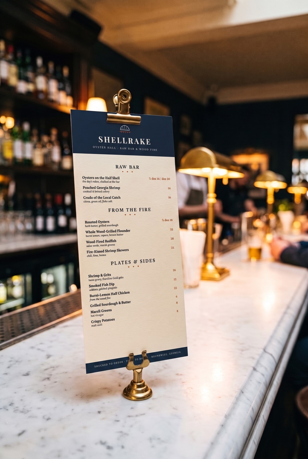 The printed Shellrake menu standing in a brass holder on the marble bar